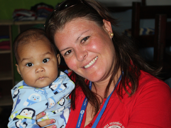 Nidia and a child at NPH Honduras.
